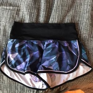 blue and purple running shorts